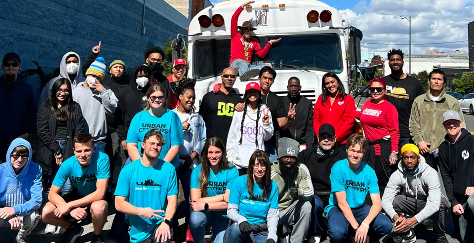 DO GOOD volunteers gathered beside the outreach bus on Skid Row