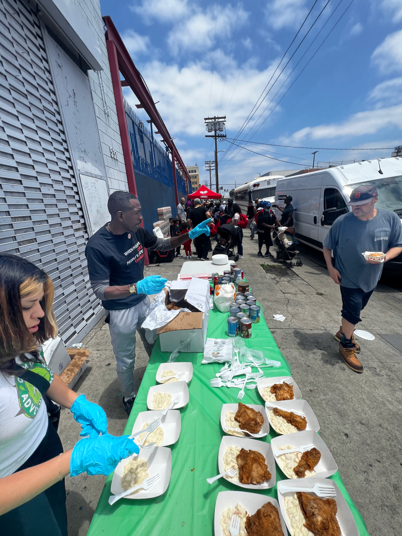DO GOOD volunteers serving food at the Sunday Service on Towne Avenue